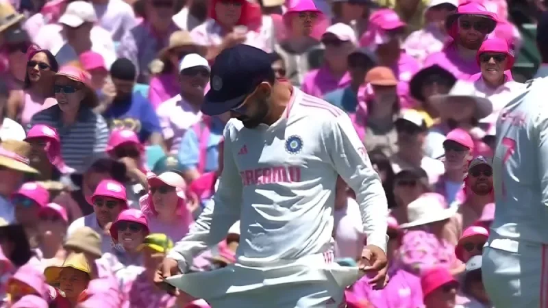 Watch Virat Kohli mocks the SCG crowd with a controversial sandpaper gesture after Steven Smith’s wicket, sparking heated reactions.